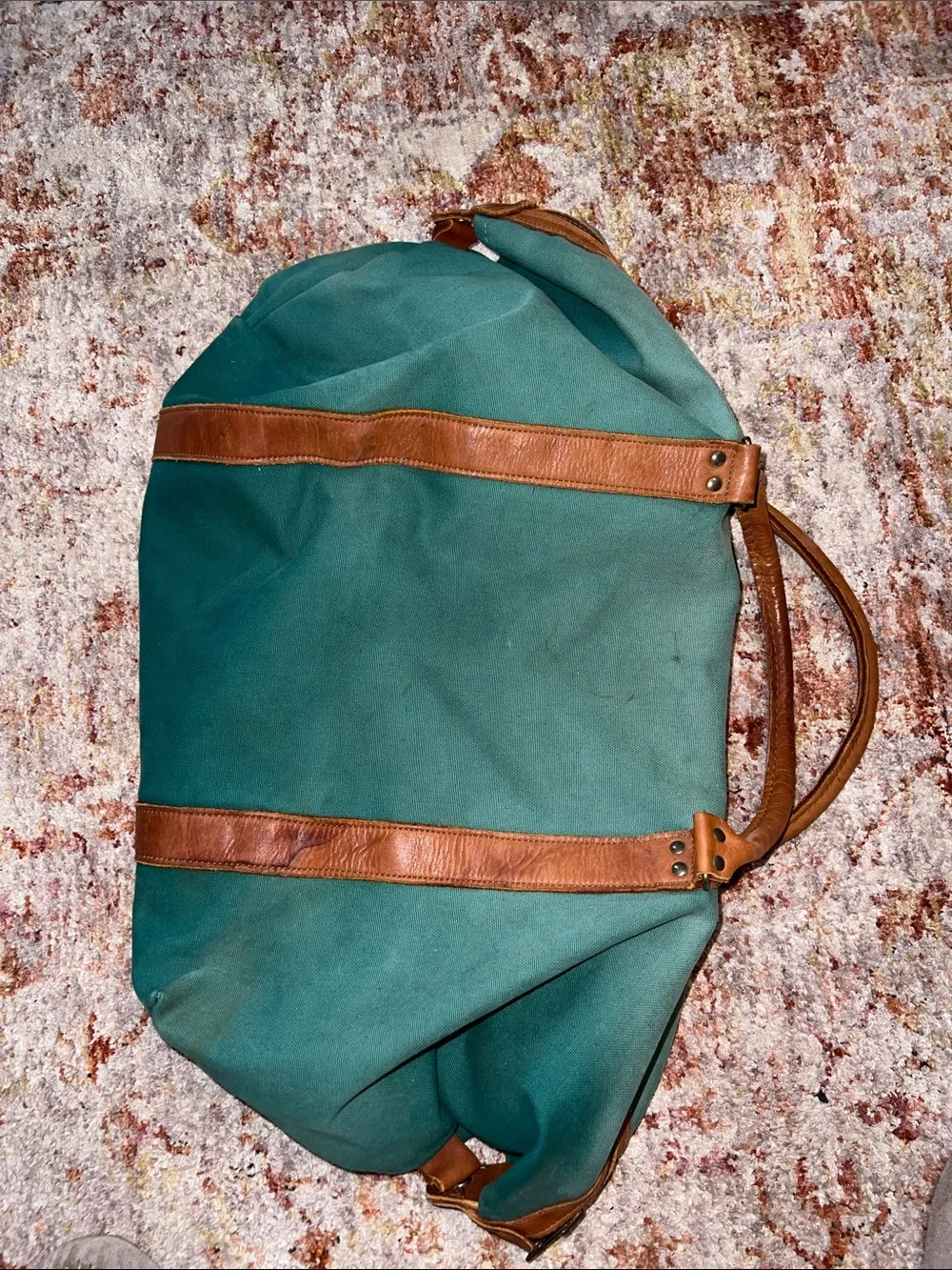 Vintage green duffle bag with leather handles